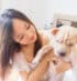 Vet clinic ponte vedra showing picture of female veterinarian holding a puppy and smiling